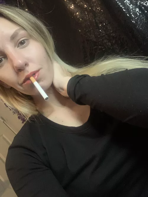 Black shirt and a smoke