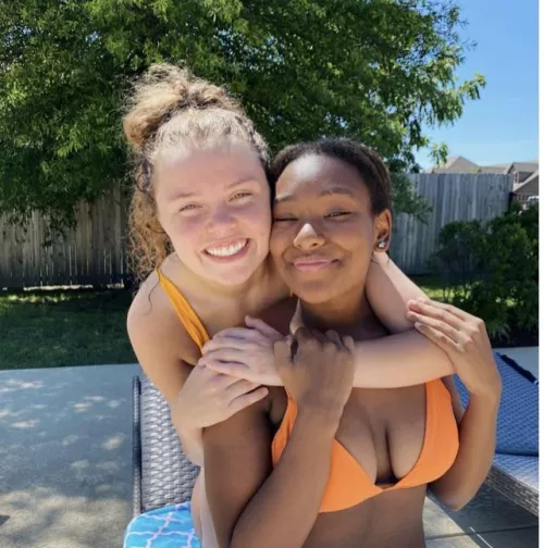 Hiding behind her friend