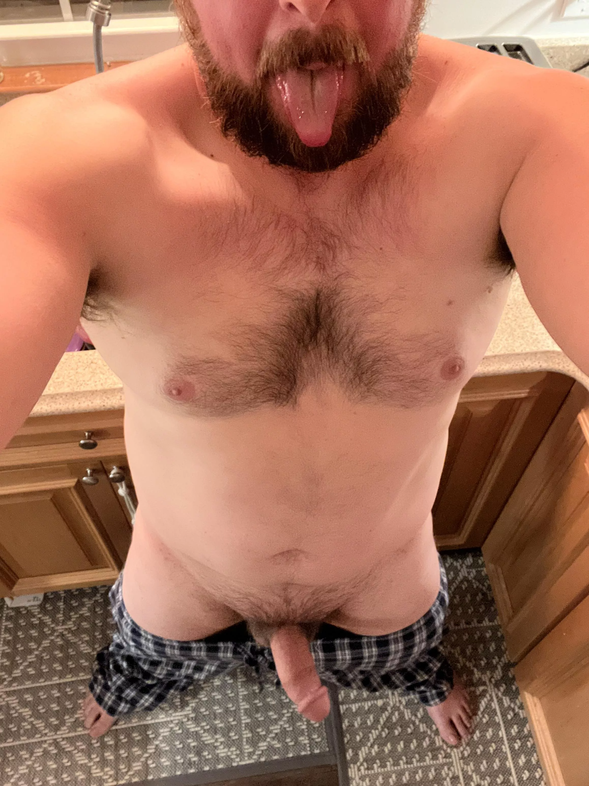 Horny dad in kitchen looking for midnight snack, who wants to be it?