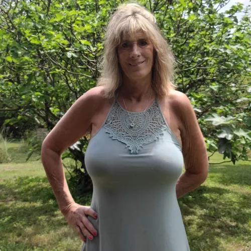 look at this busty mystery gilf. what would you do to her?