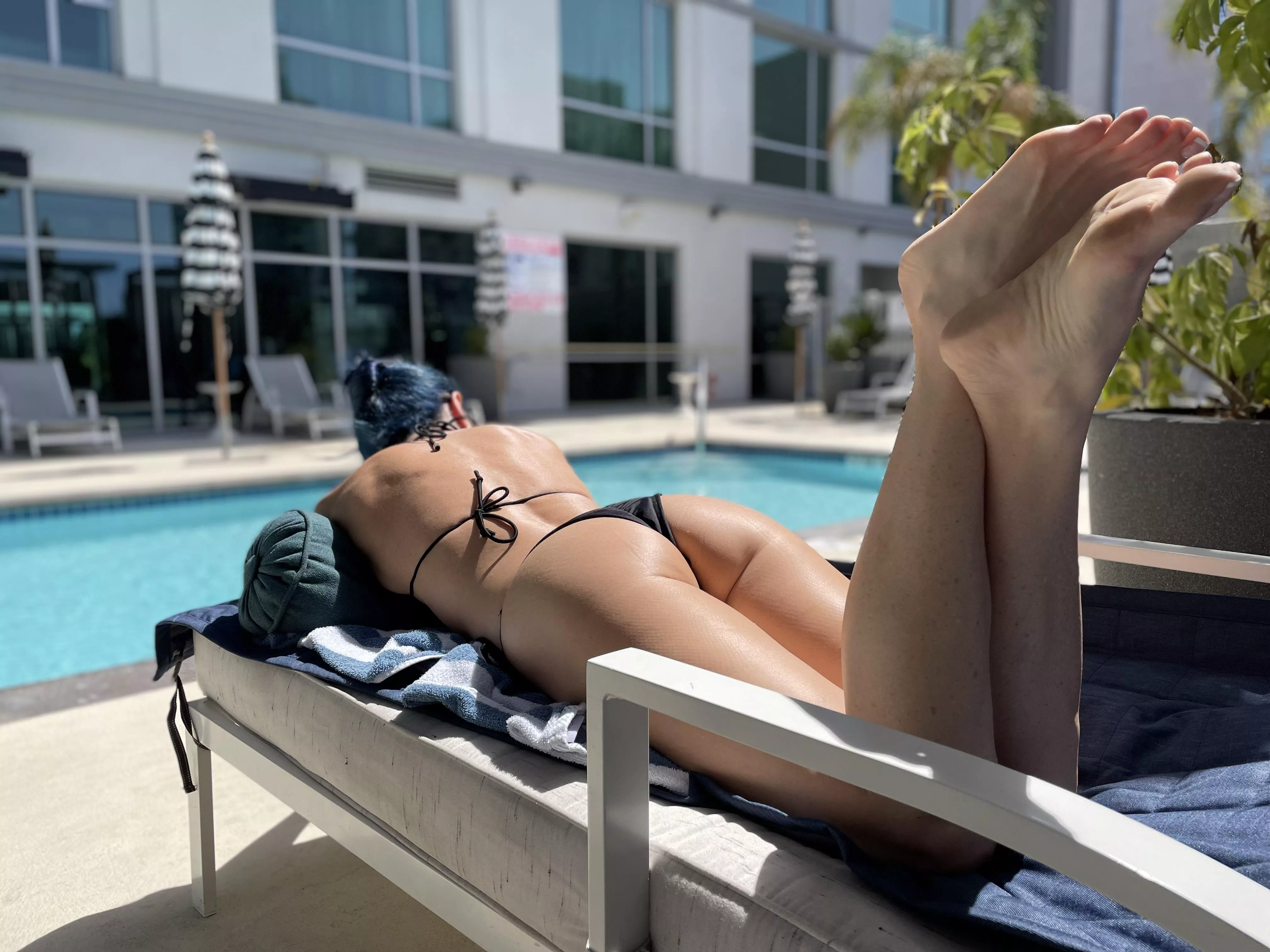 Lounging by the hotel pool. Is the phone stand too much?