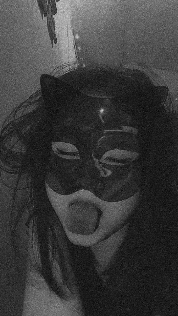 Tongue out, mask on