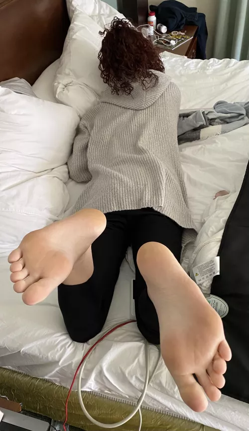 Wife on bed. Soles showing. Kind of a “reverse pose”