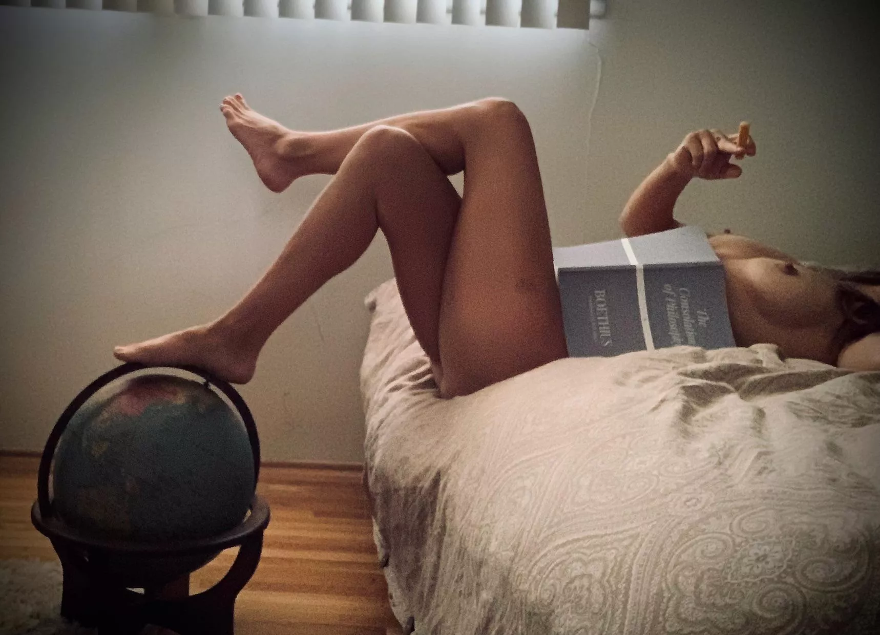 “A nude woman was sitting on the edge of a desk next to a globe of the world. The suggested onanism with the piece of chalk intrigued Ignatius. Her face was hidden behind a large book.” “A nude woman was sitting on the edge of a desk next to a globe of the world. The suggested onanism with the piece of chalk intrigued Ignatius. Her face was hidden behind a large book.”