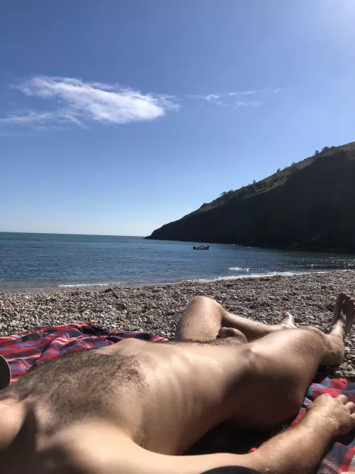a photo i took of my bf relaxing nude on the beach
