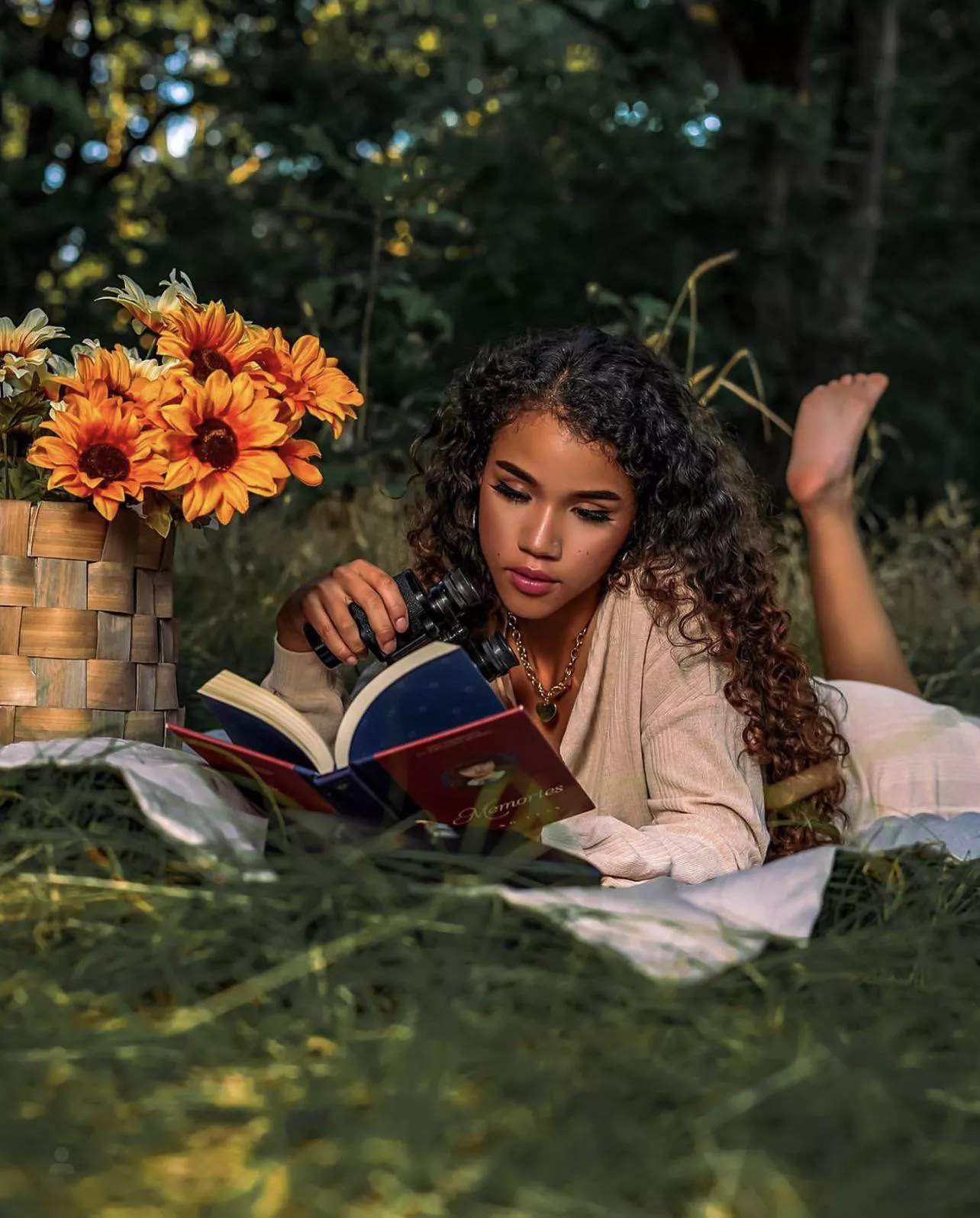 Beautiful sunflower reading a book