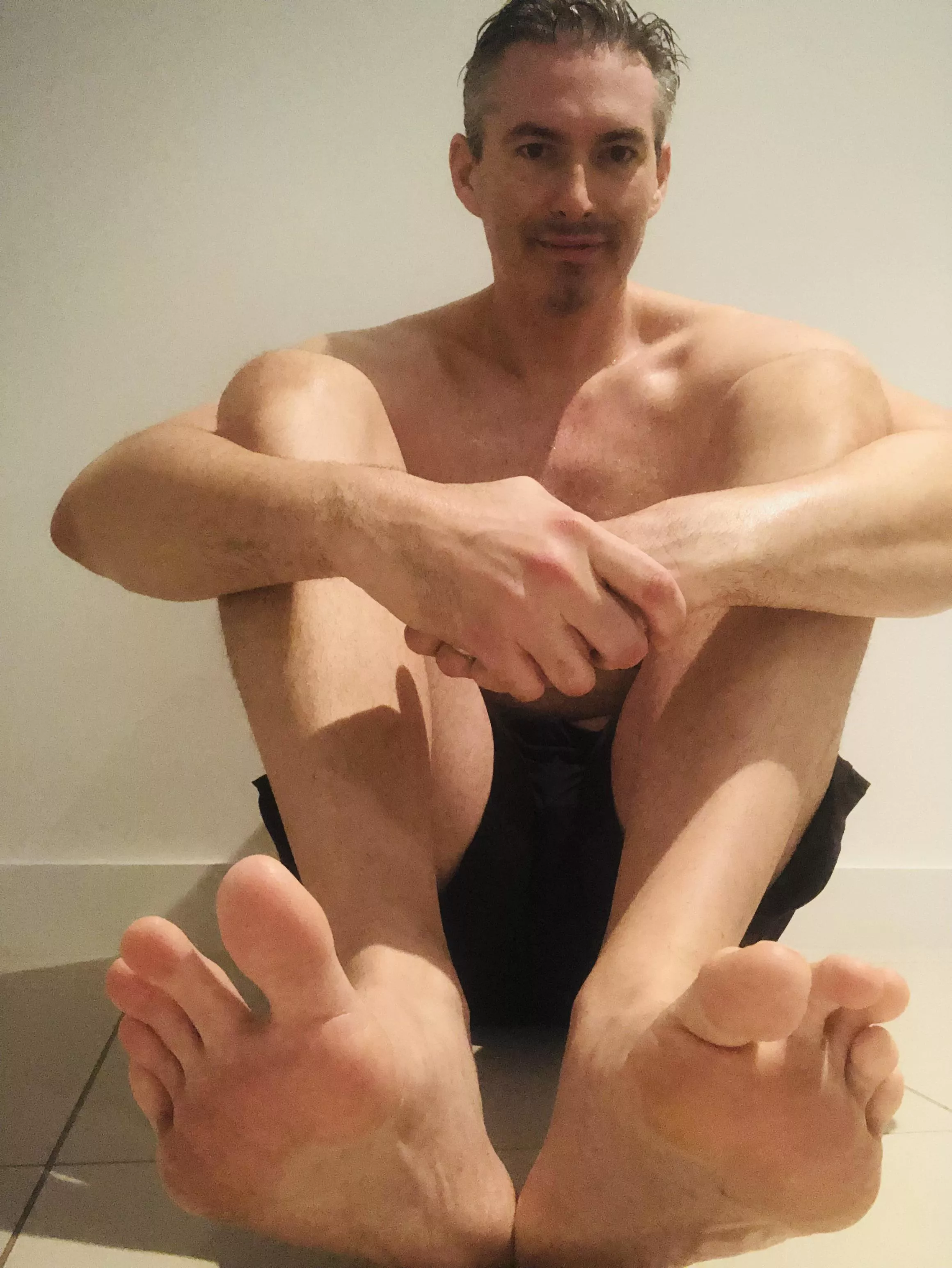 Feeling hot and sweaty after my workout. Who wants these big feet? 😉
