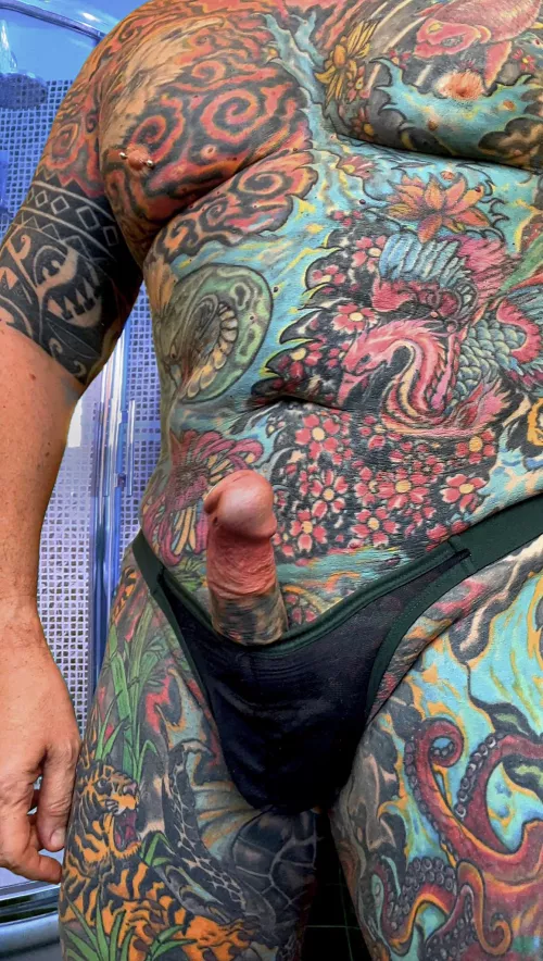 Full body tattoo with erect dick