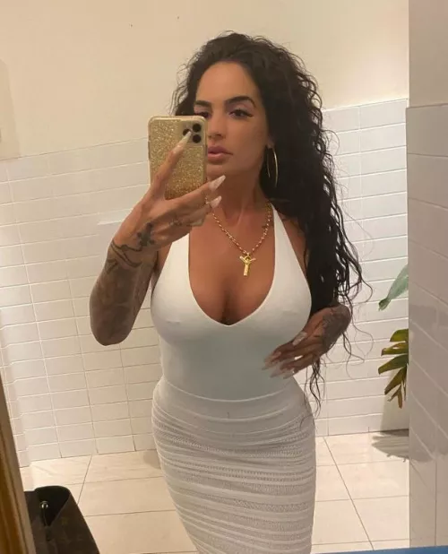 Long stiletto nails + fakes tits. She’s a bimbo in my eyes.