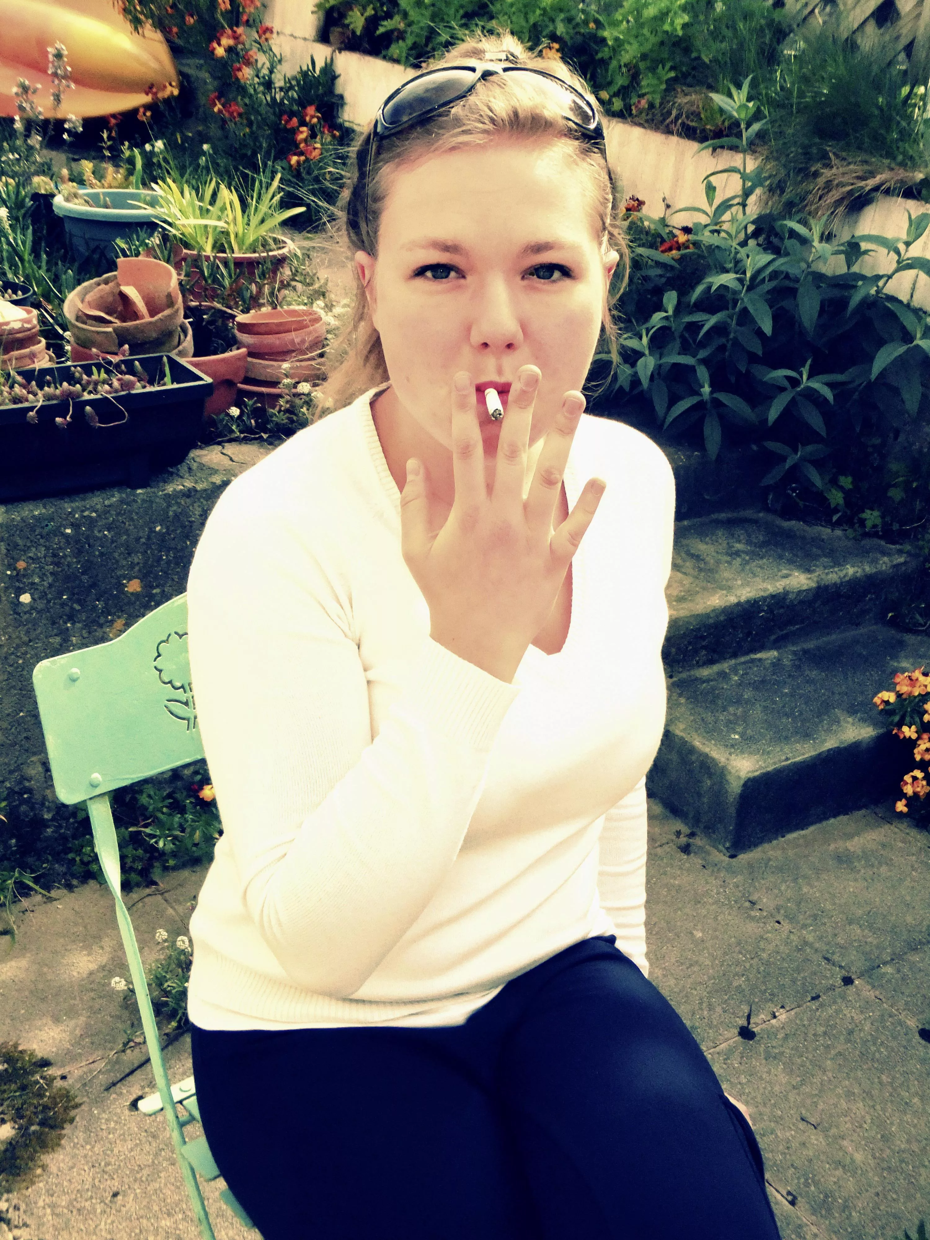My girlfriend, dragging on her cigarette…