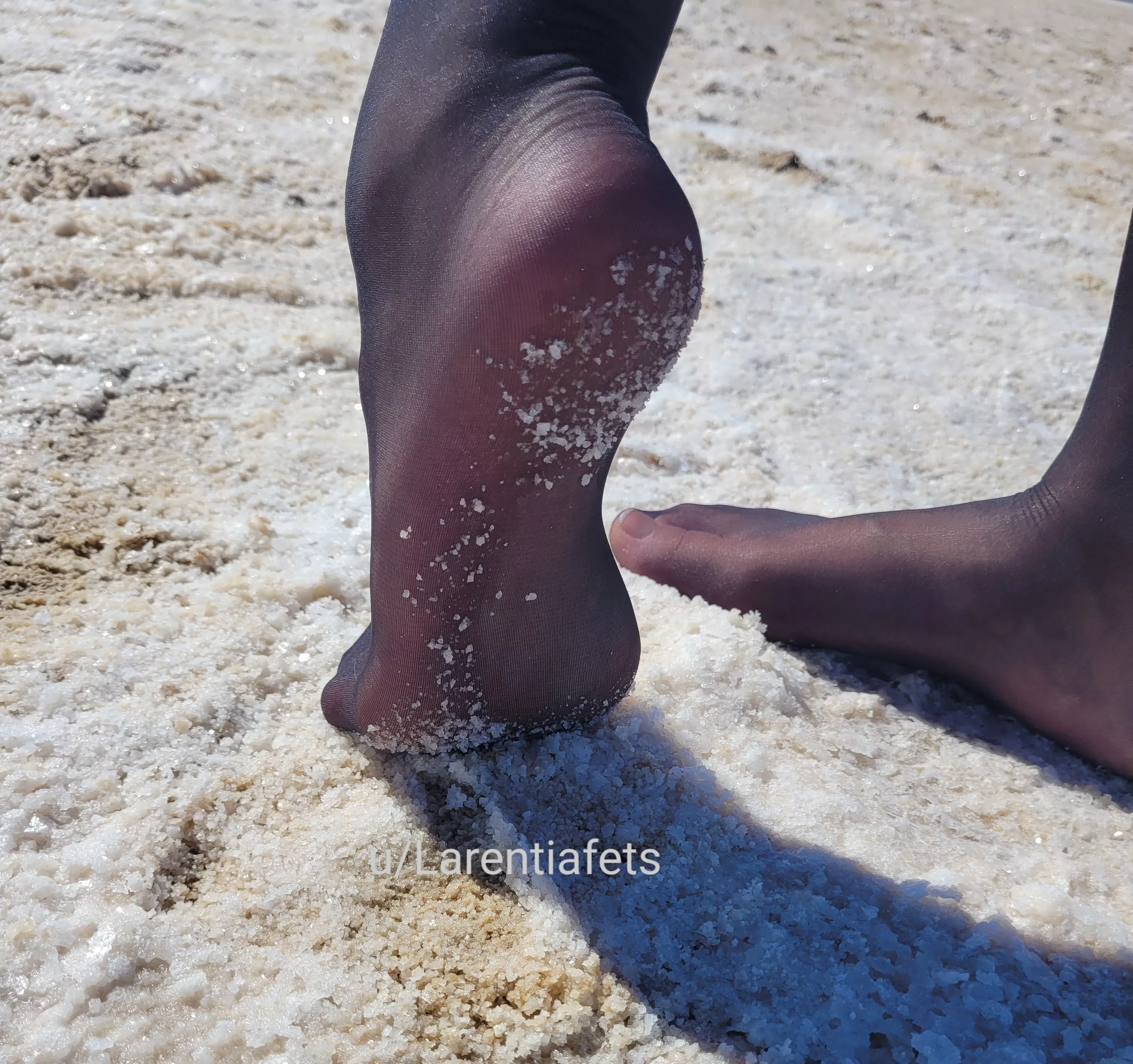 Pantyhose feet on salt lake