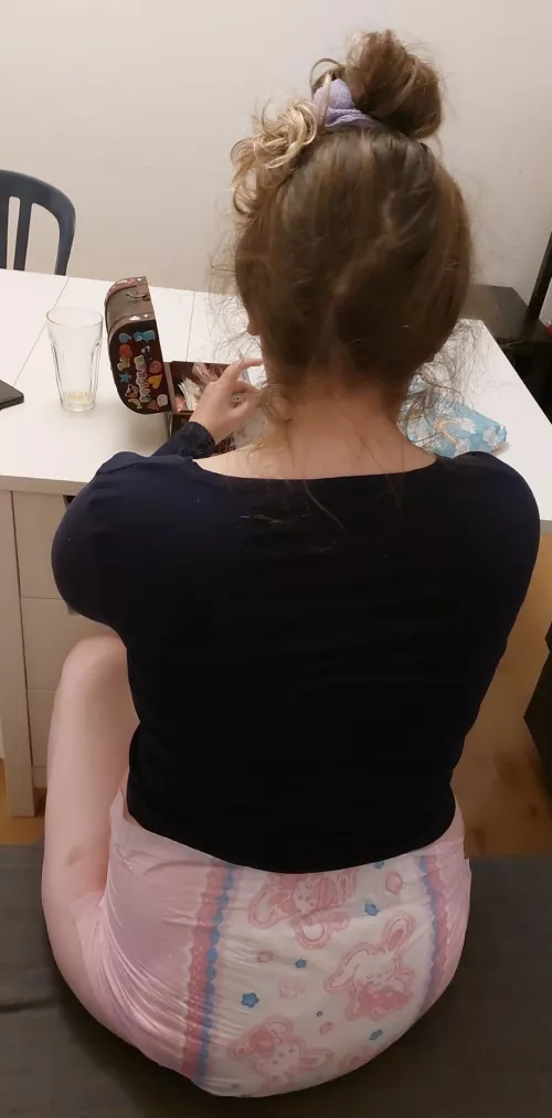 Princess choosing stickers to put on a gift for a little friend