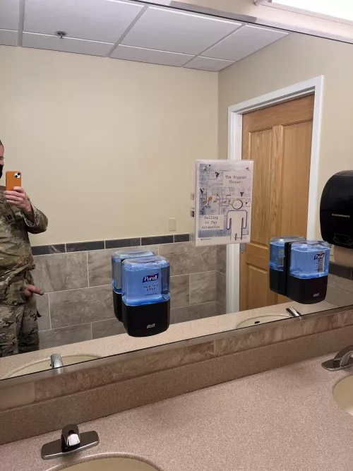 Public restroom. One guy in stall, two talking right outside the door