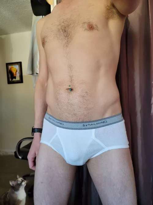 Taking pictures in my tight white briefs and getting judged by the cat.