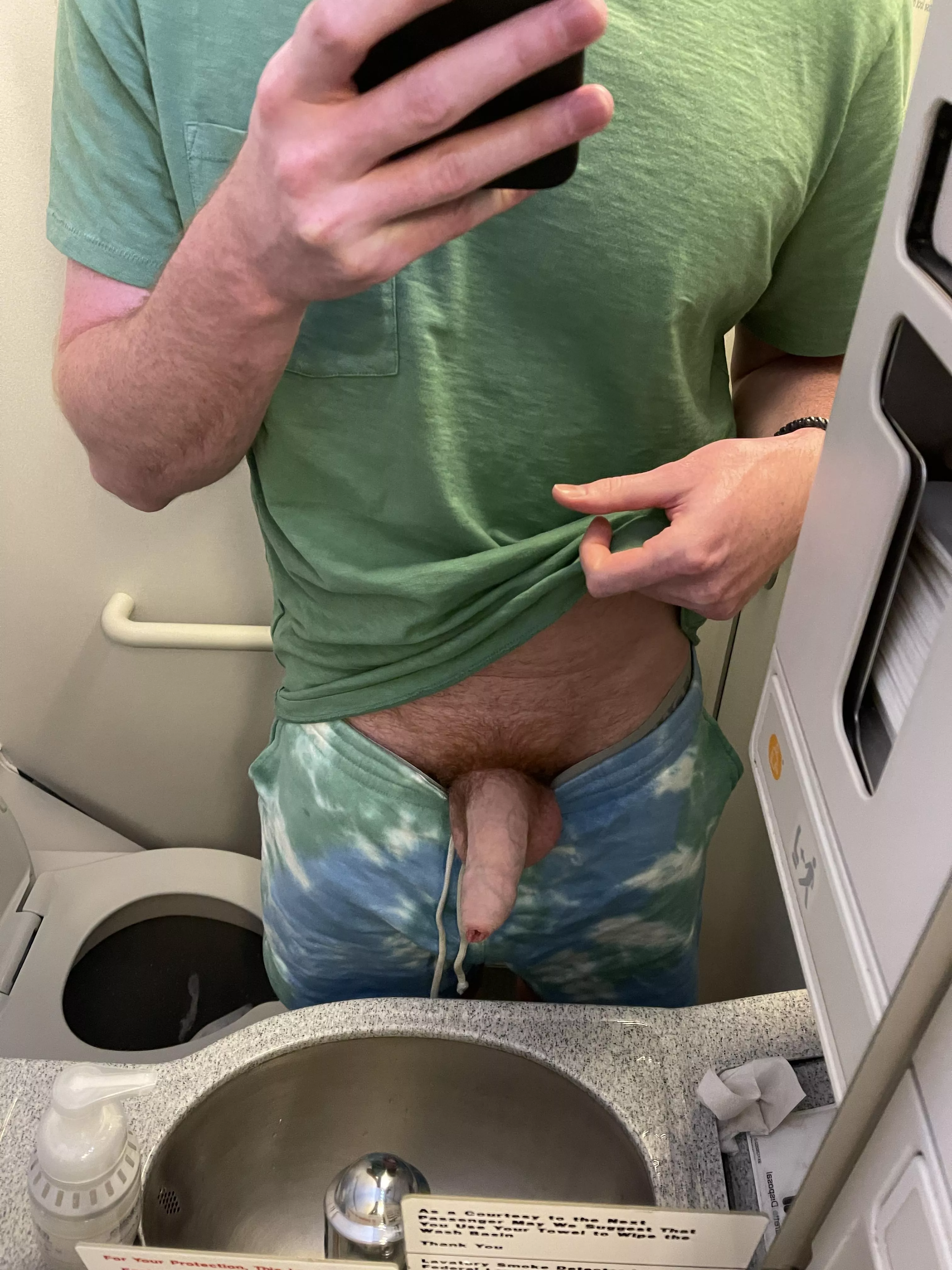 The flight attendants were inches away but I had to pull my dick out