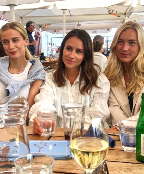 The girls leaning over the table